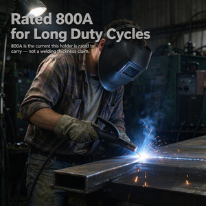 A person wearing a welding helmet and gloves uses a welding torch to weld a metal tube, with bright blue sparks and smoke in a workshop. Large text at the top reads 'Rated 800A for Long Duty Cycles' with smaller explanatory text below.